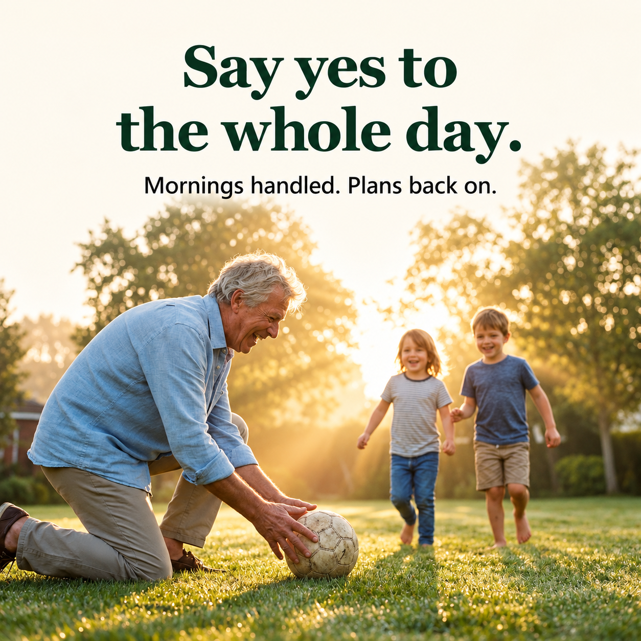 Grandfather playing football with grandchildren on a bright morning
